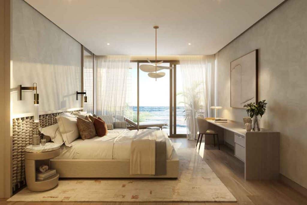 Japanese minimalist living room interior at Nobu Residences on Saadiyat Island, Abu Dhabi, featuring natural wood and floor-to-ceiling windows.